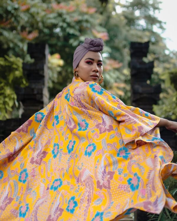 Beautiful portrait of a Malaysian woman in traditional colorful attire. Captured in Kuala Lumpur, showcasing vibrant style and culture.